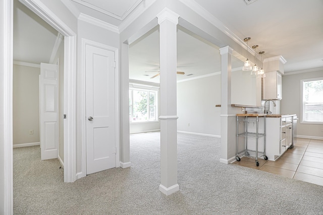 831 Jackman St, Benton, AR 72015 - kitchen featuring light colored carpet, decorative columns, healthy amount of natural light, and ornamental molding
