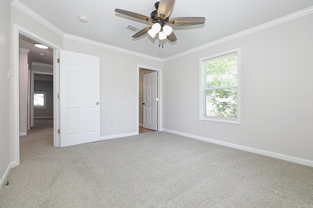 831 Jackman St, Benton, AR 72015 - unfurnished bedroom with ornamental molding, carpet flooring, multiple windows, and baseboards