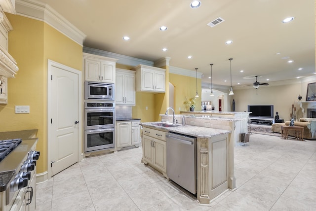 1606 Hilldale, Alexander, AR 72002 - kitchen featuring stainless steel appliances, ornamental molding, a ceiling fan, open floor plan, and light stone counters