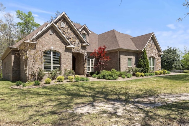 1606 Hilldale, Alexander, AR 72002 - view of front of home featuring brick siding, a front yard, stone siding, and a shingled roof