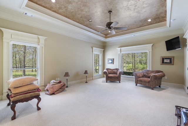 1606 Hilldale, Alexander, AR 72002 - sitting room featuring a raised ceiling, carpet floors, ornamental molding, healthy amount of natural light, and a ceiling fan
