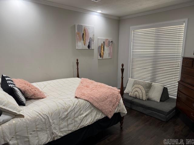 2012 Paula St, Pocahontas, AR 72455 - bedroom with wood finished floors, ornamental molding, and recessed lighting