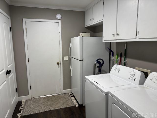 2012 Paula St, Pocahontas, AR 72455 - washroom featuring independent washer and dryer, baseboards, ornamental molding, and dark wood-style flooring