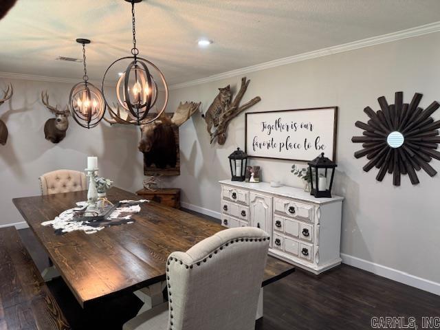 2012 Paula St, Pocahontas, AR 72455 - dining area with a chandelier, ornamental molding, baseboards, and dark wood-type flooring