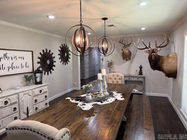2012 Paula St, Pocahontas, AR 72455 - dining room with a chandelier, dark wood-type flooring, baseboards, ornamental molding, and recessed lighting