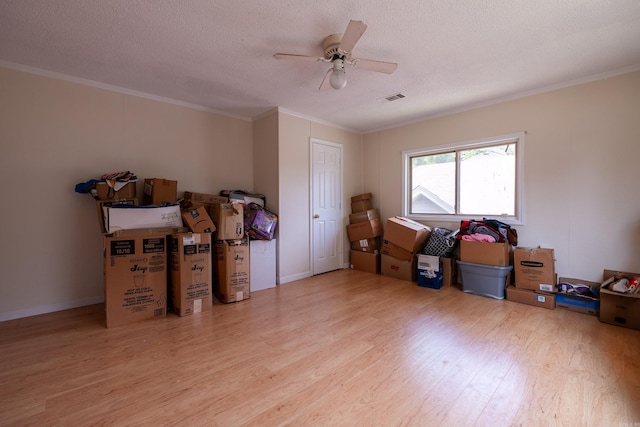 1411 Maple St, North Little Rock, AR 72114 - misc room featuring wood finished floors, ornamental molding, a textured ceiling, and ceiling fan