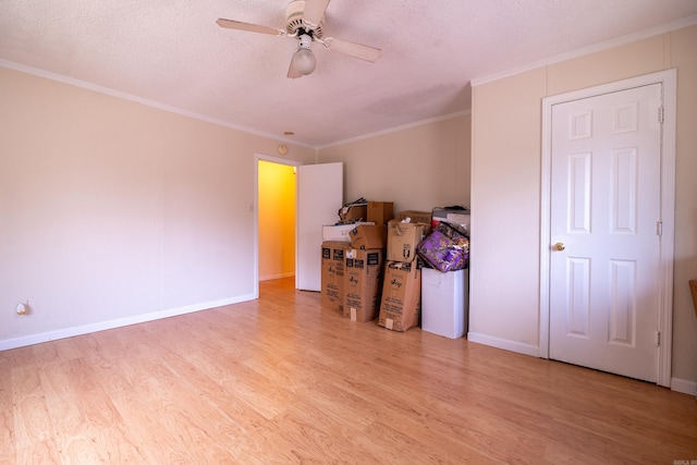 1411 Maple St, North Little Rock, AR 72114 - bedroom featuring wood finished floors, a textured ceiling, ornamental molding, baseboards, and a ceiling fan