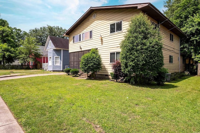 1411 Maple St, North Little Rock, AR 72114 - view of property exterior featuring a yard and crawl space
