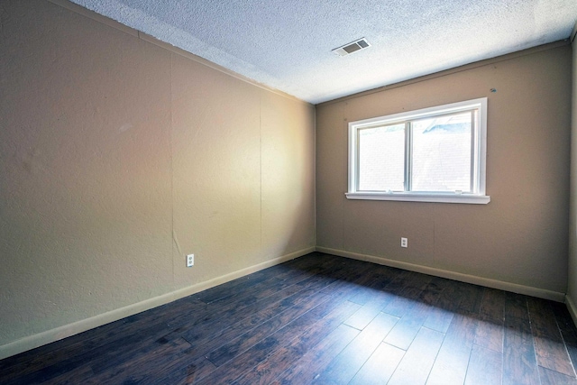 1411 Maple St, North Little Rock, AR 72114 - unfurnished room with a textured ceiling, wood finished floors, and baseboards