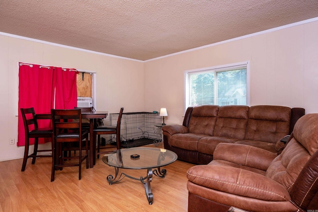 1411 Maple St, North Little Rock, AR 72114 - living area featuring wood finished floors, a textured ceiling, and ornamental molding