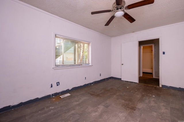 1411 Maple St, North Little Rock, AR 72114 - spare room featuring a textured ceiling, ceiling fan, and baseboards