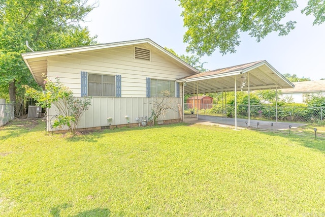 612 E E St, Russellville, AR 72801 - view of front of property featuring a carport, central AC, and crawl space