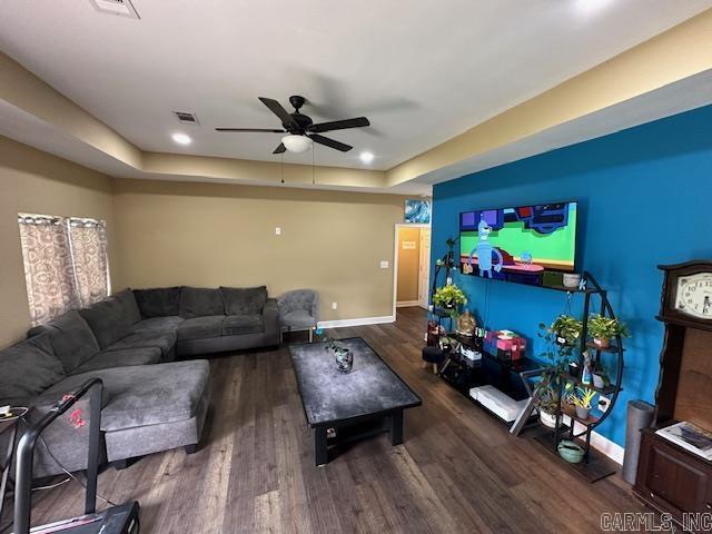 1415 Ben St, North Little Rock, AR 72117 - living area featuring ceiling fan, a raised ceiling, baseboards, and wood finished floors
