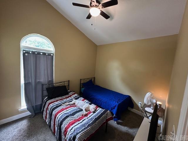 1415 Ben St, North Little Rock, AR 72117 - bedroom with carpet flooring, baseboards, lofted ceiling, and a ceiling fan
