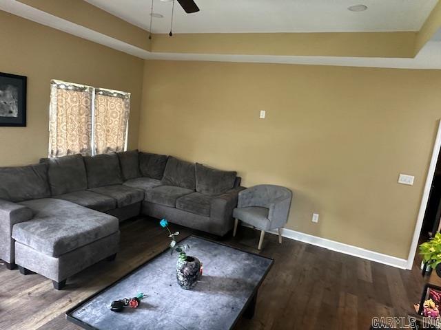 1415 Ben St, North Little Rock, AR 72117 - living room featuring dark wood-style flooring, baseboards, and a ceiling fan