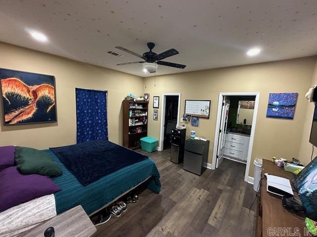1415 Ben St, North Little Rock, AR 72117 - bedroom with dark wood-type flooring, baseboards, recessed lighting, a ceiling fan, and fridge
