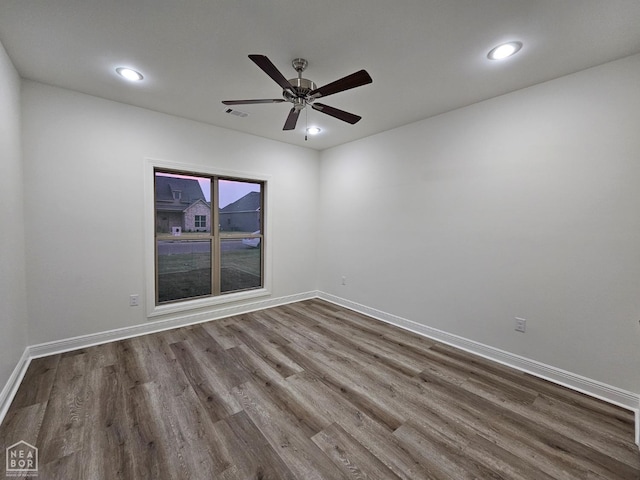 125 Hidden Creek Dr, Brookland, AR 72417 - unfurnished room with dark wood-type flooring, recessed lighting, baseboards, and a ceiling fan