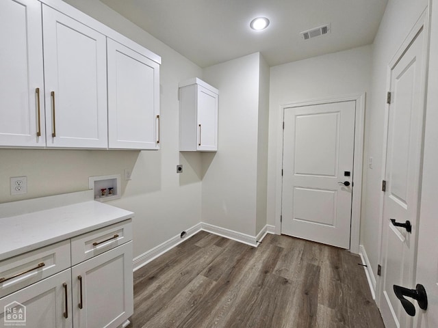 125 Hidden Creek Dr, Brookland, AR 72417 - laundry room with cabinet space, dark wood-type flooring, hookup for an electric dryer, baseboards, and recessed lighting