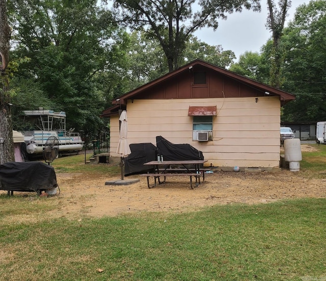 14412 Quinn Rd, Maumelle, AR 72113 - rear view of house featuring a lawn and cooling unit
