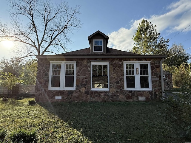 view of property exterior with stone siding