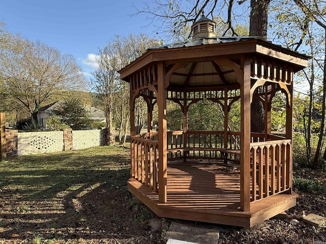 wooden terrace featuring a gazebo