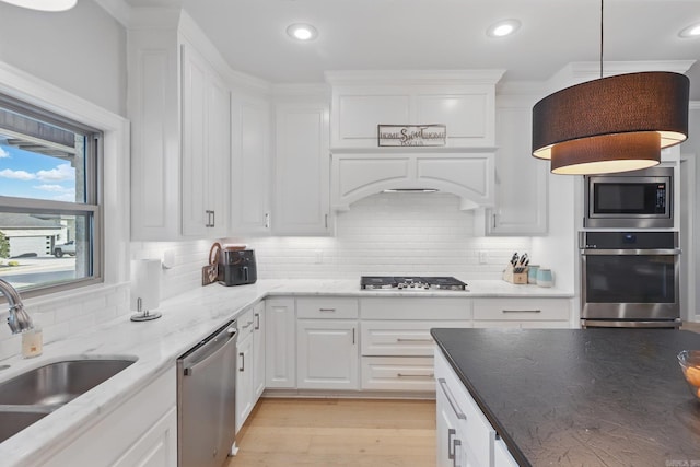 7429 Lake Point Cir, Benton, AR 72019 - kitchen featuring appliances with stainless steel finishes, a sink, white cabinetry, and recessed lighting