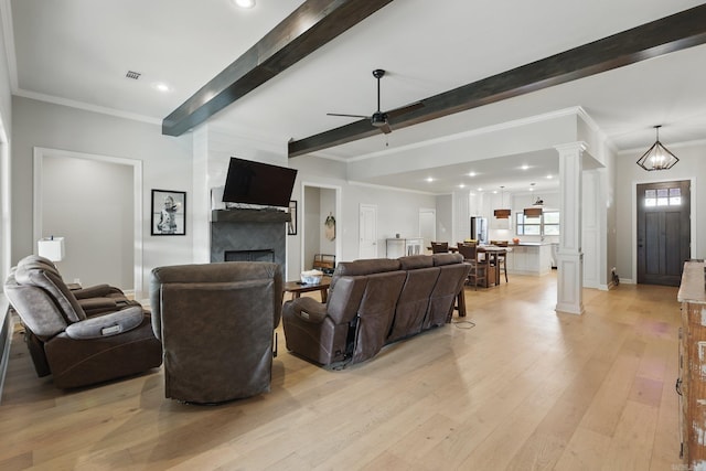 7429 Lake Point Cir, Benton, AR 72019 - living area with ornate columns, ceiling fan, beamed ceiling, light wood-style floors, and crown molding