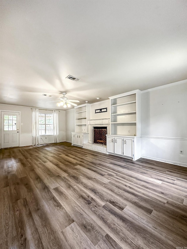 23 Morrison Ct, Little Rock, AR 72212 - unfurnished living room featuring a ceiling fan, a fireplace with raised hearth, and dark wood finished floors