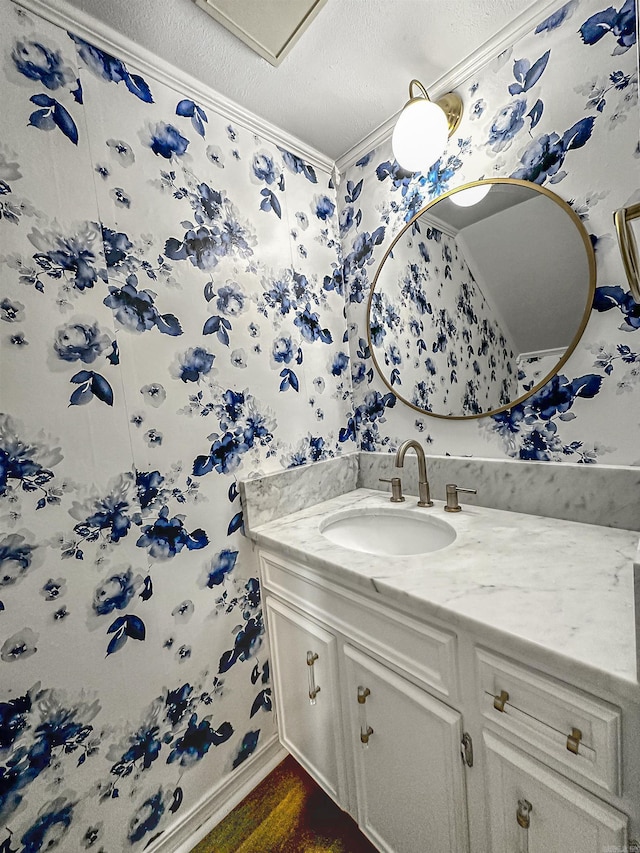 23 Morrison Ct, Little Rock, AR 72212 - bathroom with a textured ceiling, vanity, wallpapered walls, and crown molding