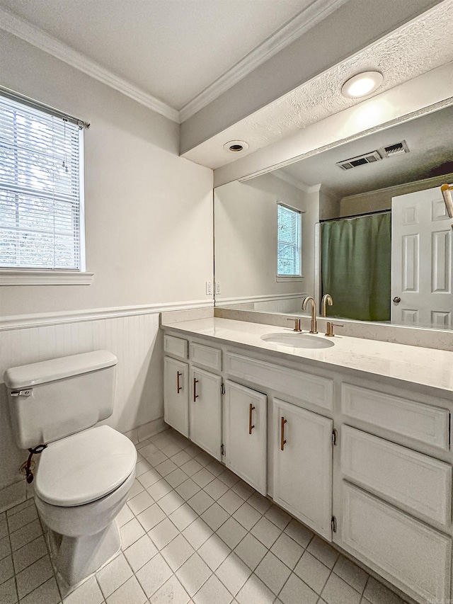 23 Morrison Ct, Little Rock, AR 72212 - full bath with crown molding, toilet, vanity, tile patterned floors, and a wainscoted wall