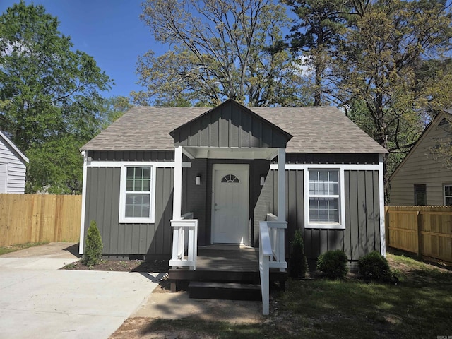 4518 W 25th, Little Rock, AR 72204 - bungalow-style house with board and batten siding, a shingled roof, and a fenced backyard