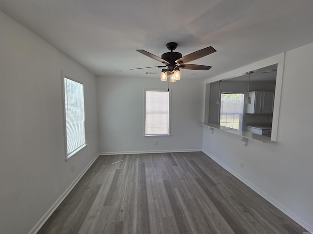 4518 W 25th, Little Rock, AR 72204 - spare room featuring wood finished floors, baseboards, and a ceiling fan
