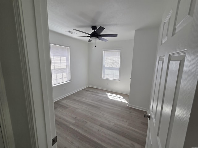 4518 W 25th, Little Rock, AR 72204 - unfurnished room featuring plenty of natural light, ceiling fan, and baseboards