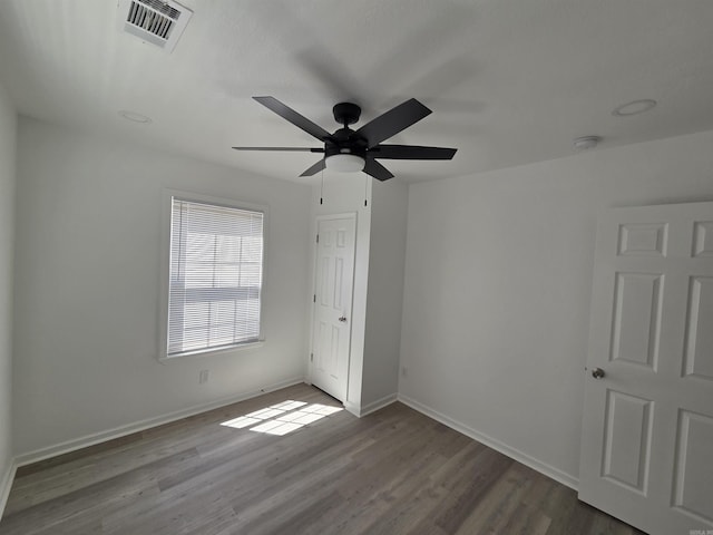 4518 W 25th, Little Rock, AR 72204 - unfurnished bedroom with wood finished floors, baseboards, and a ceiling fan