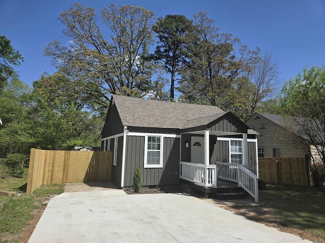 4518 W 25th, Little Rock, AR 72204 - bungalow with board and batten siding, a shingled roof, and a porch