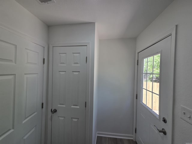 4518 W 25th, Little Rock, AR 72204 - doorway with baseboards and wood finished floors