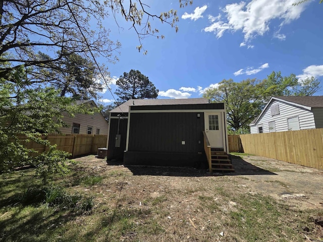 4518 W 25th, Little Rock, AR 72204 - back of house with entry steps and a fenced backyard