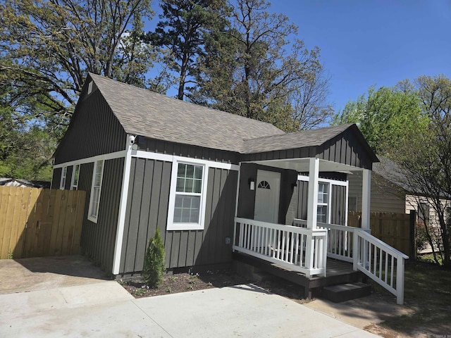 4518 W 25th, Little Rock, AR 72204 - bungalow-style house featuring roof with shingles, a porch, and board and batten siding