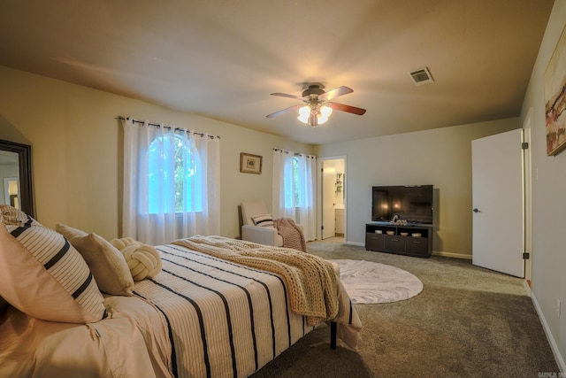 2318 Breckenridge Dr, Little Rock, AR 72227 - bedroom with carpet, baseboards, a ceiling fan, and ensuite bathroom