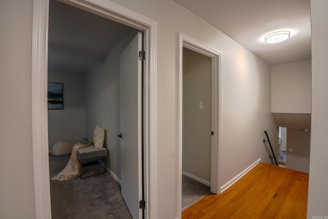 2318 Breckenridge Dr, Little Rock, AR 72227 - hallway featuring an upstairs landing, carpet floors, and baseboards