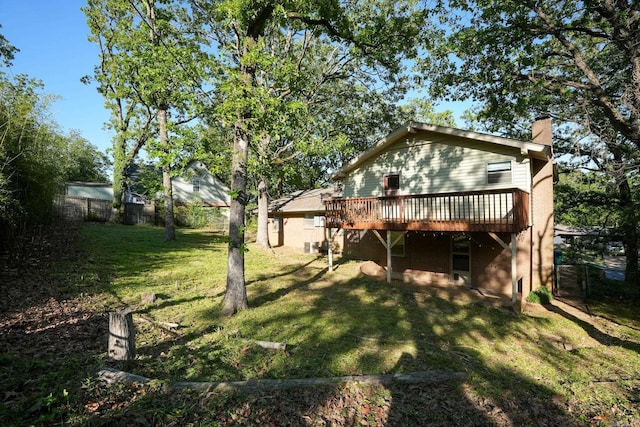 2318 Breckenridge Dr, Little Rock, AR 72227 - rear view of property featuring a deck and a chimney