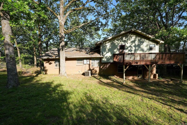 2318 Breckenridge Dr, Little Rock, AR 72227 - back of property featuring a wooden deck and a lawn