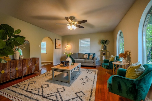 2318 Breckenridge Dr, Little Rock, AR 72227 - living area with arched walkways, a ceiling fan, plenty of natural light, and wood finished floors