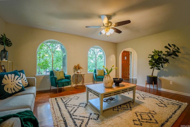 2318 Breckenridge Dr, Little Rock, AR 72227 - living room featuring arched walkways, ceiling fan, wood finished floors, and baseboards