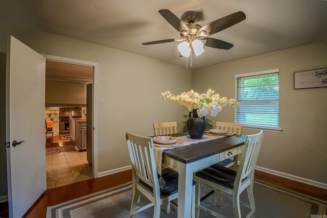2318 Breckenridge Dr, Little Rock, AR 72227 - dining space featuring wood finished floors, a ceiling fan, and baseboards