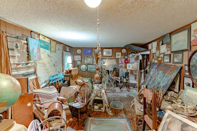 1788 Weatherstone Rd, Mammoth Spring, AR 72554 - misc room with wood finished floors, a textured ceiling, and wood walls