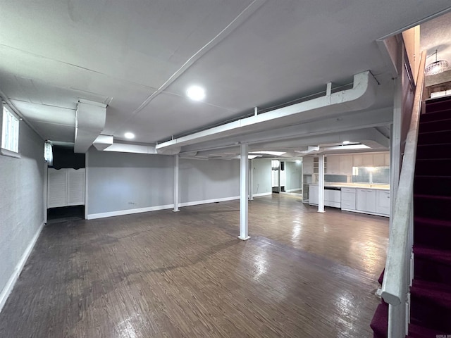 582 N Fourth Ave, Piggott, AR 72454 - finished below grade area featuring stairway, baseboards, dark wood-style flooring, and recessed lighting