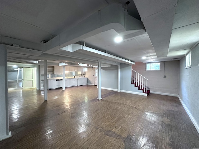 582 N Fourth Ave, Piggott, AR 72454 - basement with stairway, dark wood-type flooring, and baseboards
