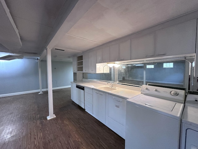 582 N Fourth Ave, Piggott, AR 72454 - laundry room featuring washer / clothes dryer, dark wood-type flooring, and baseboards