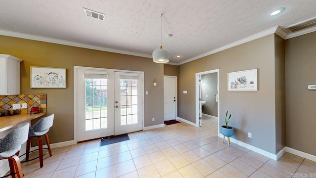 3805 Irby Dr, Conway, AR 72034 - entryway with ornamental molding, baseboards, a textured ceiling, french doors, and recessed lighting